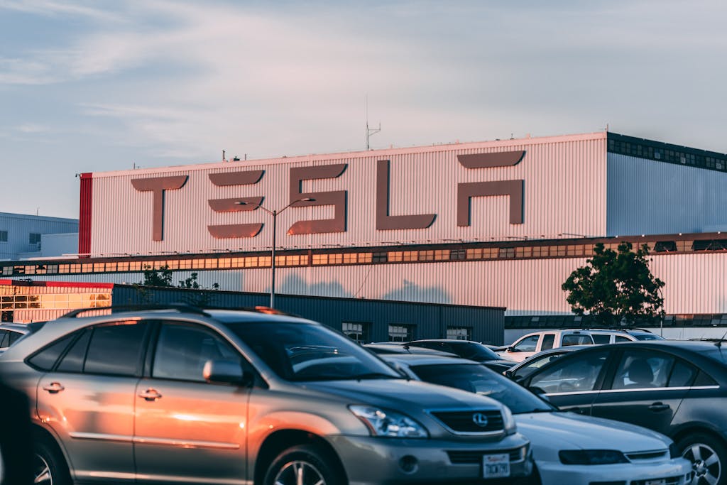 Cars Parked In Front Of Tesla Building