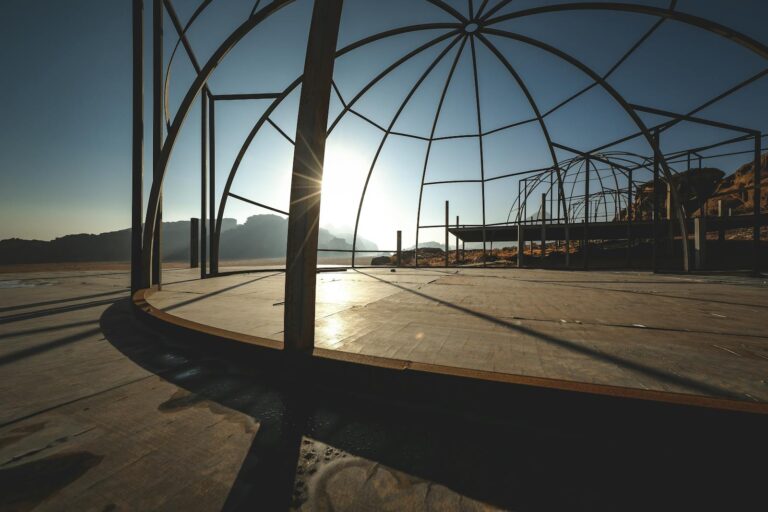 Sunlit silhouette of a dome structure in the Wadi Rum desert, Jordan. Perfect for themes of construction, adventure.