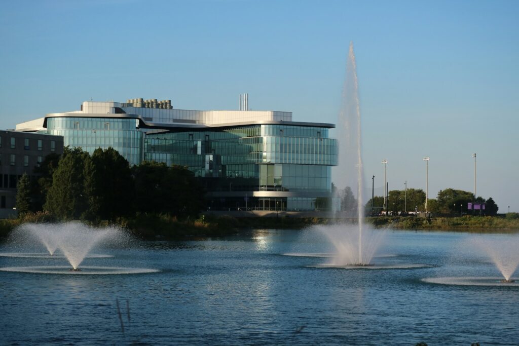 a large building with a fountain in front of it