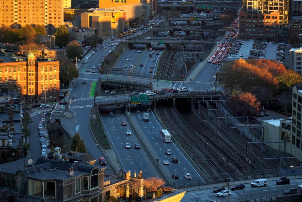 An aerial view of a city with a train on the tracks