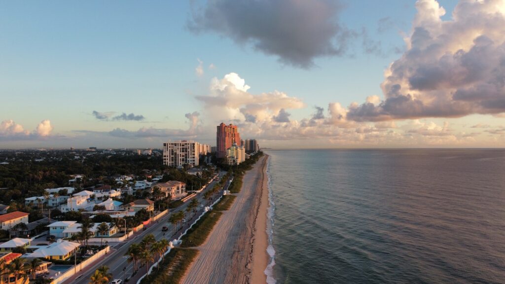 an aerial view of a beach and a city