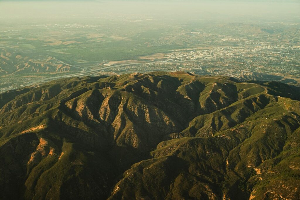 Mountains and a city stretch into the distance.
