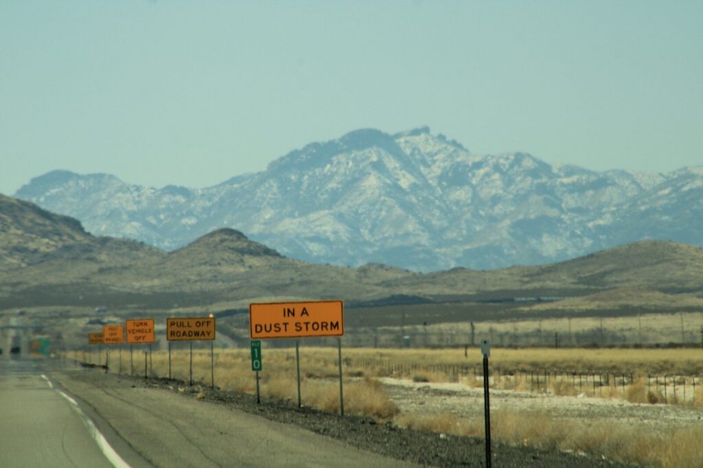 a highway with mountains in the background