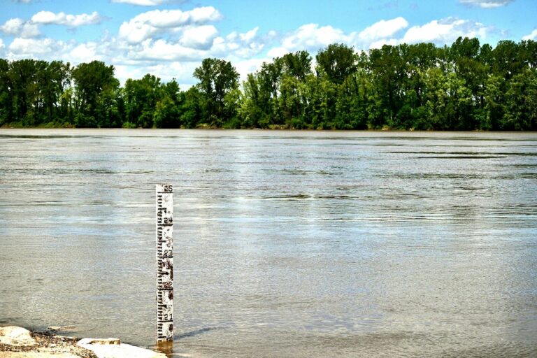 a sign that is in the middle of a body of water