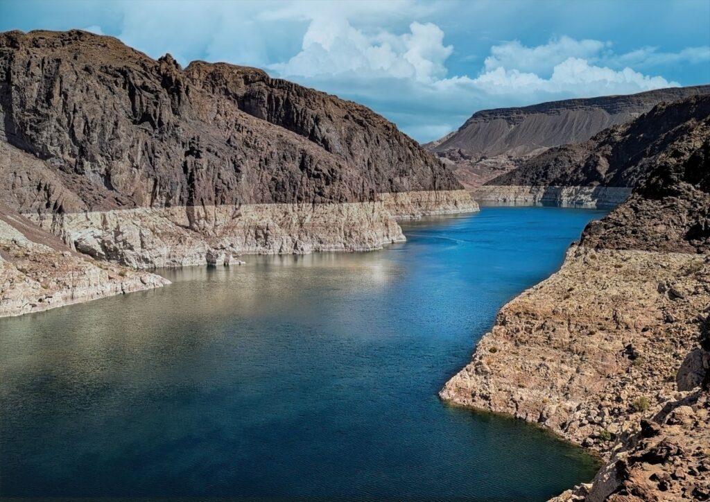 Breathtaking aerial view of the Colorado River cutting through the rocky canyons, offering a mesmerizing natural landscape.