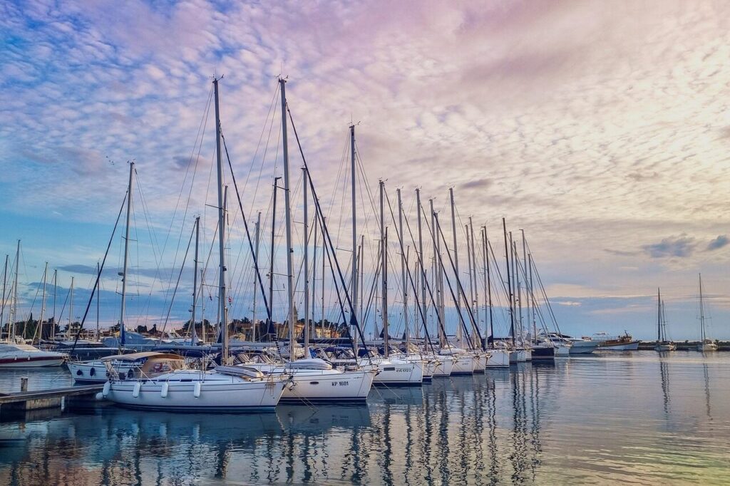marina, sailboats, harbor, sunset, yachts, sea, sailing, nature, nautical, boats, dock, reflections, peaceful, coastal, ocean view, travel, summer, vacation, maritime, sky, tranquil, water, evening light, mooring, sailboat mast, leisure