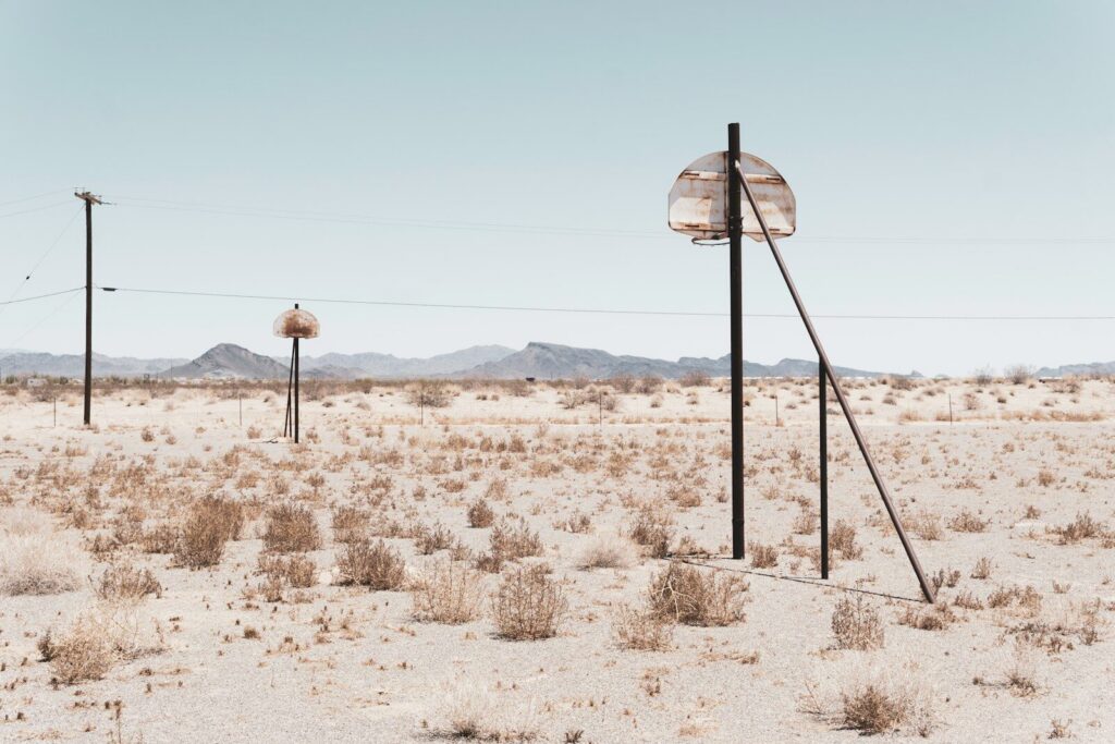 a bunch of poles in the middle of a desert