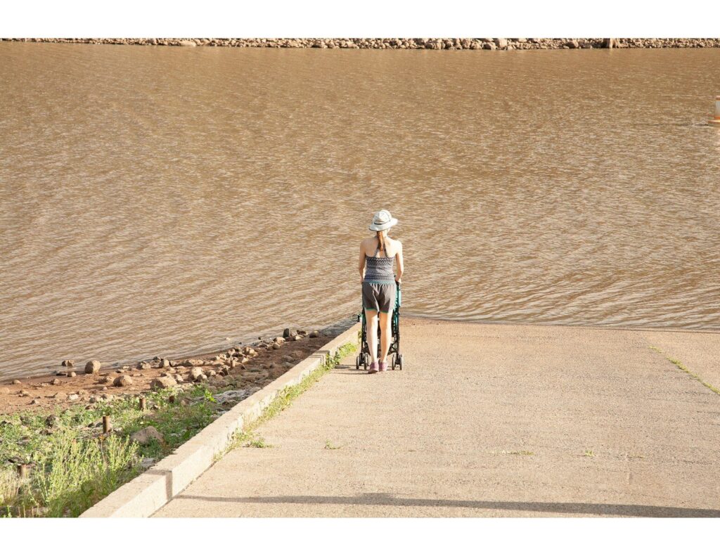 man and woman walking on the beach during daytime