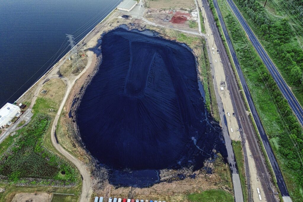 Drone shot of coal ash pond near Alma, Wisconsin highlighting environmental impact.