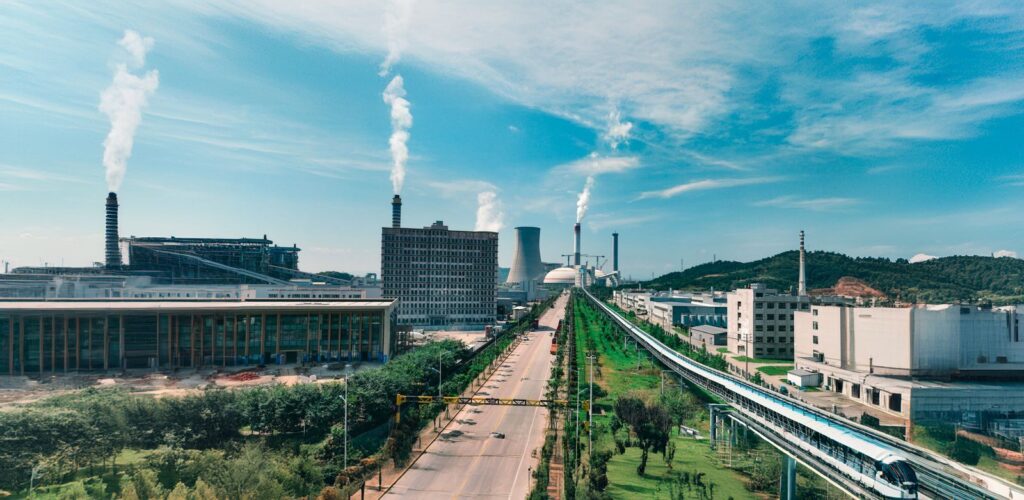 Aerial view of Jiujiang industrial area with factories and smoke stacks.